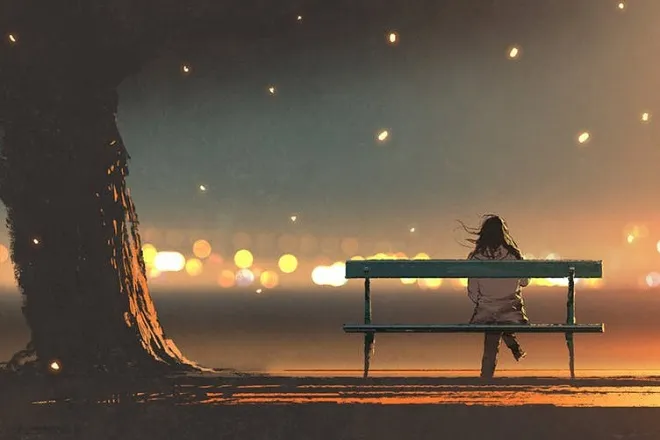Hình ảnh cô gái ngồi một mình trong bóng đêm thể hiện sự cô đơn
