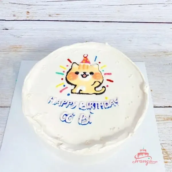 Bánh kem thôi nôi bé trai tuổi Mão với tông màu xanh dương và hình mèo ngộ nghĩnh