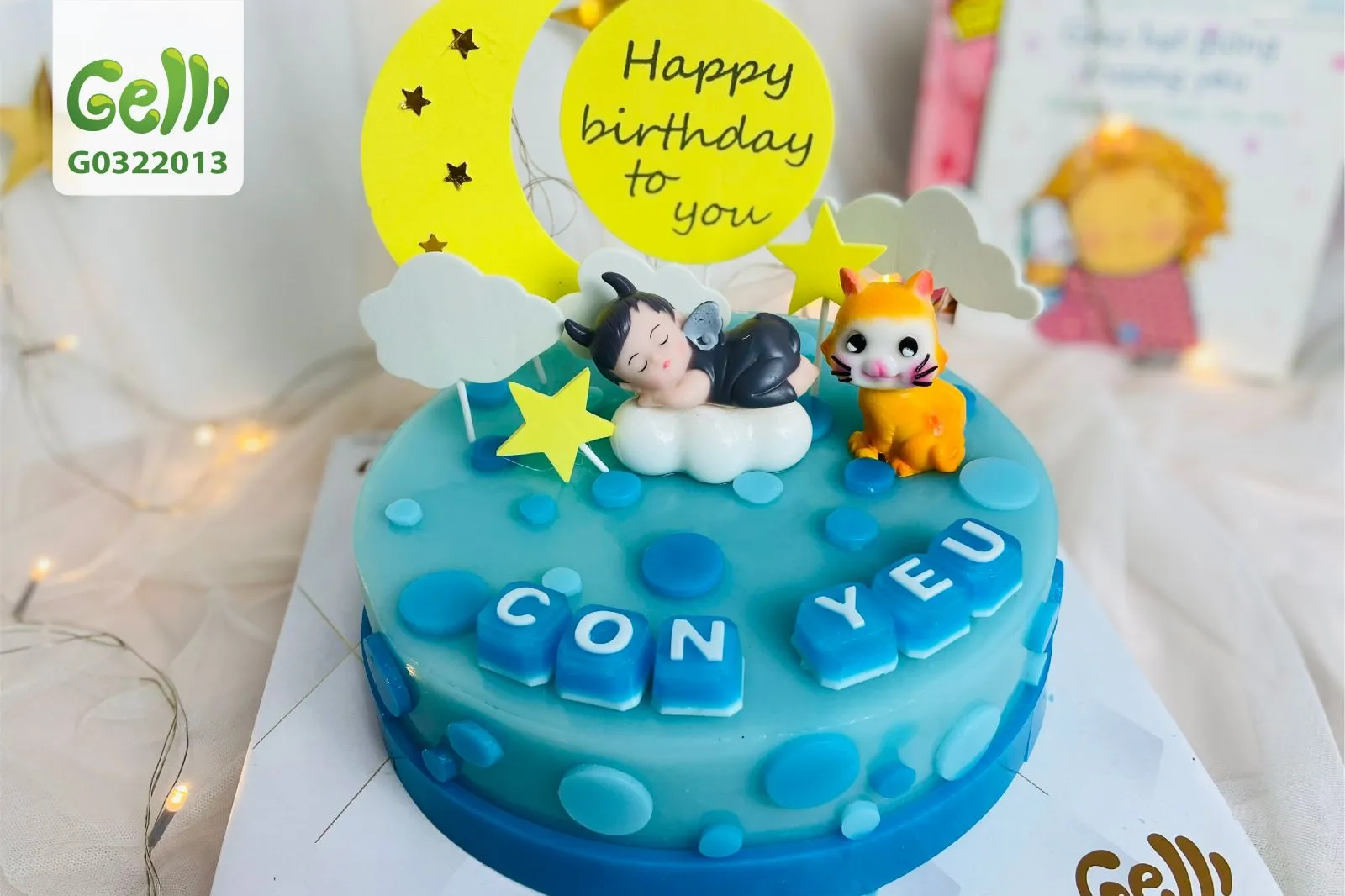 Bánh thôi nôi với họa tiết bé khỉ và màu xanh